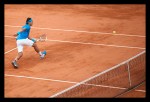 Rafael Nadal playing tennis on clay court