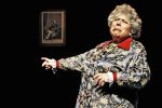 Myriam Margolyes acting in front of Dickens portrait